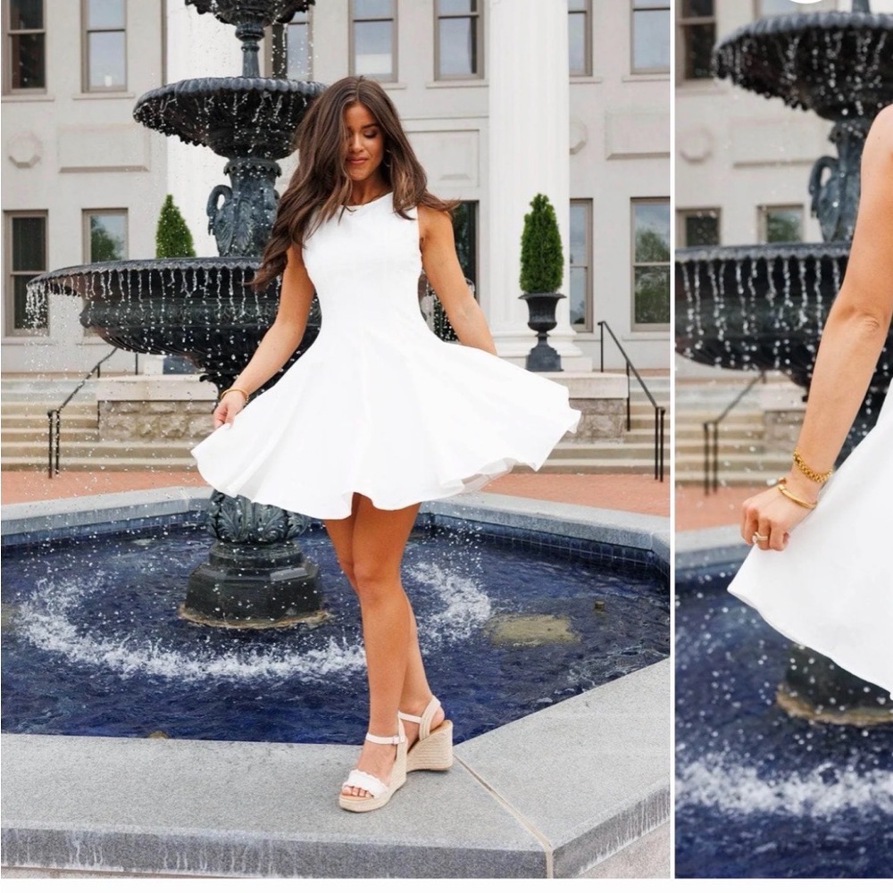 Chic White Sleeveless Mini Dress with Flared Skirt